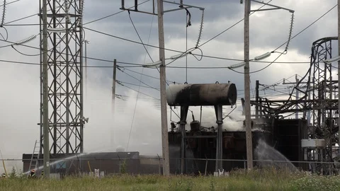 Electrical transformer for city power grid on fire at hydro substation Stock Footage 92969784