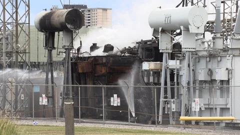 Electrical transformer for city power grid on fire at hydro substation Stock Footage 92970613