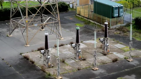 Electrical transformer of high tension in a distribution electric power station Stock Footage 147884516