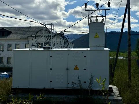 Electrical Transformer Substation Unit in Mountain Landscape Stock Photos