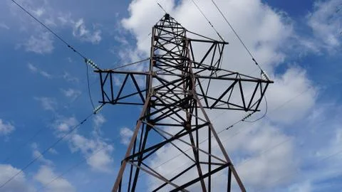 Electrical transmission tower on sky background at sunset Foto stock