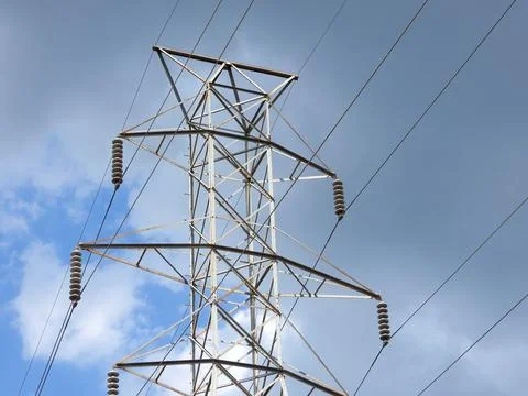 Electrical Transmission Tower Top Under Clouds Stock Photos