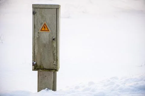 Electrical Utility Box Standing in Snow Landscape Stock Photos