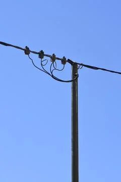 Electrical utility pole with black power cables Stock Photos