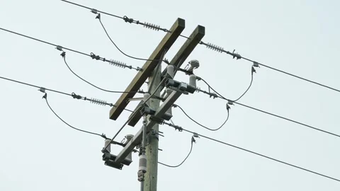 Electrical utility pole crossarms and overhead power distribution lines 動画素材 342604712