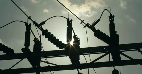 Electrical utiltity substation overhead power line sillouette electricity Stock Footage 74680597