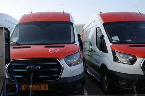 Electrical vans are charged Stock Photos