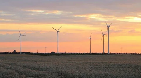 Electrical wind turbines at sunset Stock Footage 7749635