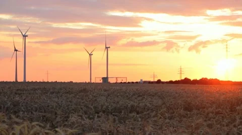 Electrical wind turbines at sunset Stock Footage 7749651