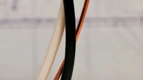 Electrical wire with blurred blueprint background Stock Footage 132738818