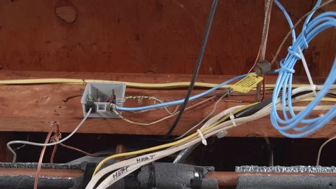 Electrical Wires and Pipe Running Along Basement Ceiling SLIDE RIGHT Stock-Footage 104874694