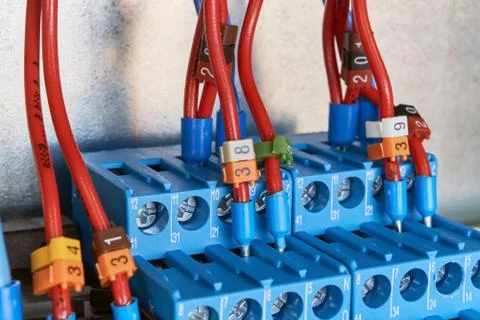 The electrical wires are connected to two intermediate relays. Stock Photos