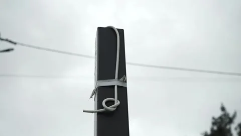 Electrical Wires are pulled out of the brick wall Stock Footage 263323424