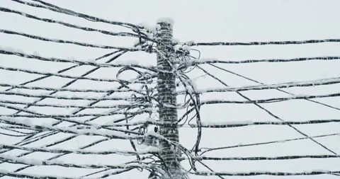 Electrical wires covered with snow Stock Footage 146483292
