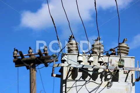 Electrical Wires Extending From The Transformer Station Near The Railway On A