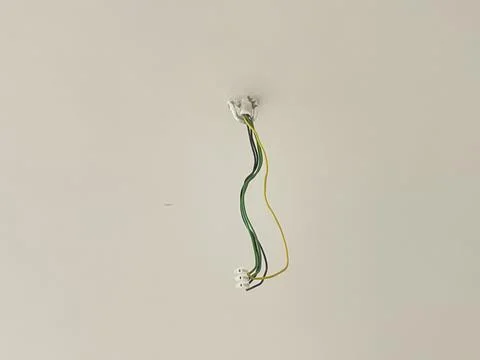 Electrical Wires Hanging from Ceiling Foto stock