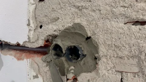 Electrical wires wall.Wall socket hole.Wall construction repair Stock Footage 340427695