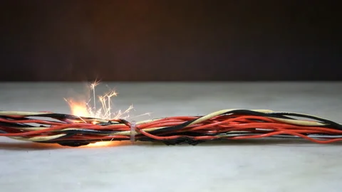 Electrical wiring and wires are highlighted on a dark background. A short circui Stock Footage 232812680