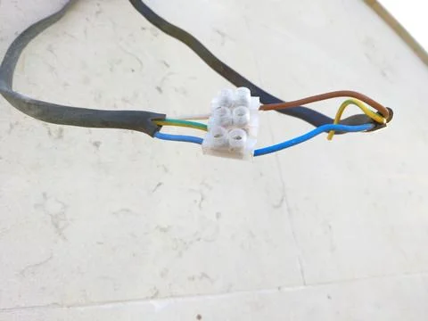 Electrical wiring connected via a plastic terminal block Stock Photos