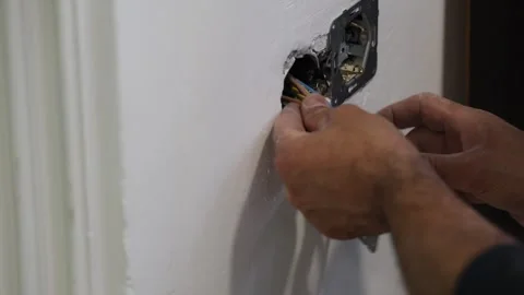 Electrical wiring installation. Electrical wires wall.Wall socket hole Stock Footage 340427503