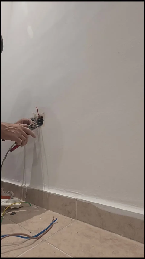 Electrical wiring installation. Electrical wires wall.Wall socket hole Stock Footage 340427581