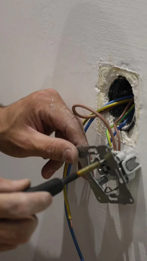 Electrical wiring installation. Electrical wires wall.Wall socket hole Stock Footage 340427747