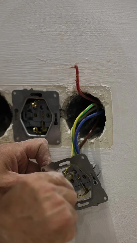 Electrical wiring installation. Electrical wires wall.Wall socket hole Stock Footage 340427760