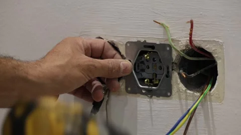 Electrical wiring installation. Electrical wires wall.Wall socket hole Stock Footage 340427788
