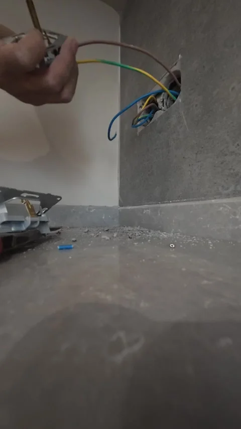 Electrical wiring installation. Electrical wires wall.Wall socket hole Stock Footage 340427813