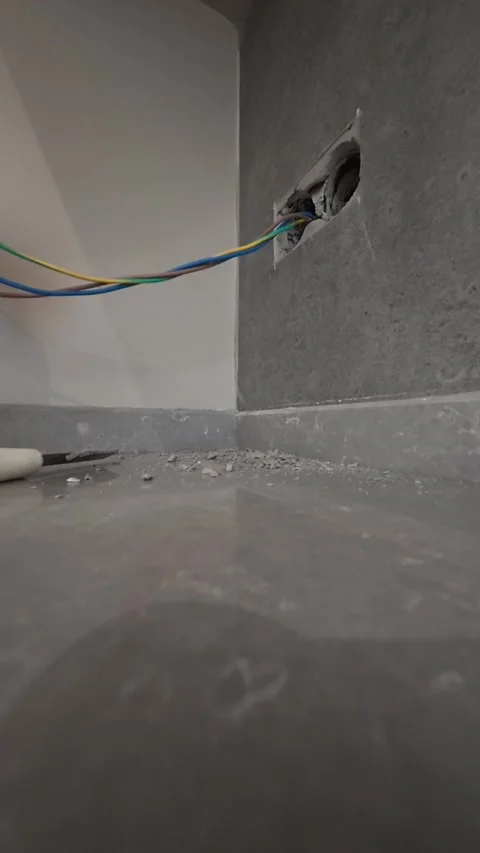 Electrical wiring installation. Electrical wires wall.Wall socket hole Stock Footage 340427842