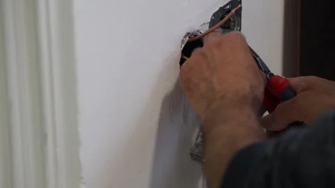 Electrical wiring installation. Electrical wires wall.Wall socket hole Stock Footage 340427871