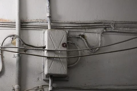 Electrical wiring on a wall with various colored wires and connectors Stock Photos