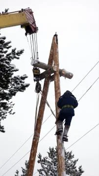 Electrical work at the height of winter Stock Photos
