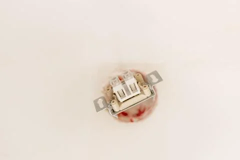 Electrical work, installation of a switch with two keys Foto stock