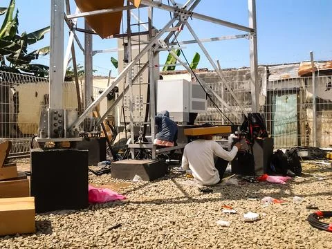 Electrical work under the sky and the sun Stock Photos