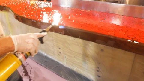 Electrical worker uses heat torch over bar top table A 스톡 동영상 125057169