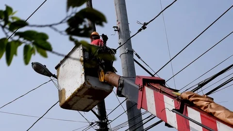 Electrical Workers On Telehandler With Bucket installing High tension wires Stock Footage 86390374