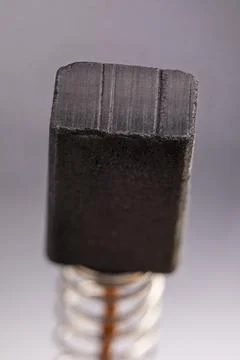 Electrically conductive graphite brush of a motor Stock Photos