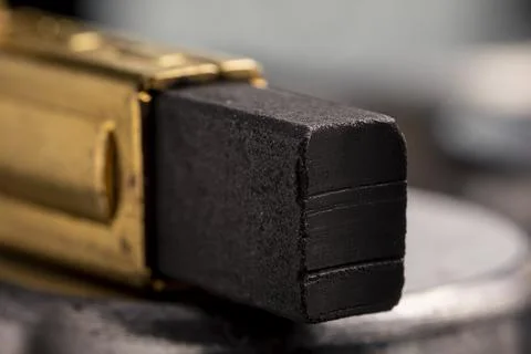 Electrically conductive graphite brush of a motor Stock Photos