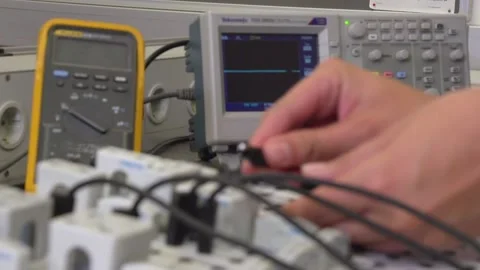 Electrician apprentice working with patch bay and different tools Stock Footage 237316053