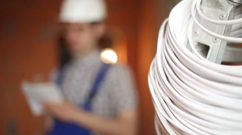Electrician on the background of the cable Video stock 61696900