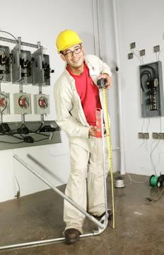 Electrician Bending Pipe Stock Photos