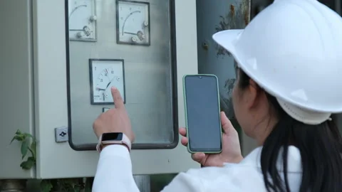 Electrician checking Analog voltmeter with dial and arrow. Stock Footage 229706480
