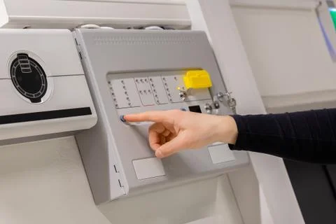 Electrician Checking Fire Alarm Panel In Datacenter Foto stock