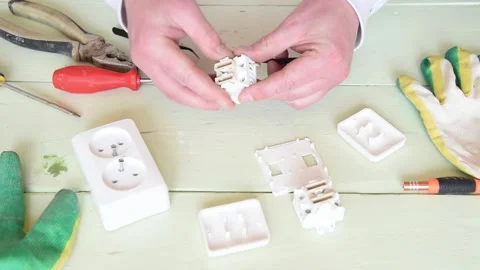 An electrician checks a broken electrical switch. Stock Footage 151136675