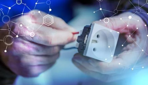 Electrician connecting a wire into a power socket; multiple exposure Stock Photos