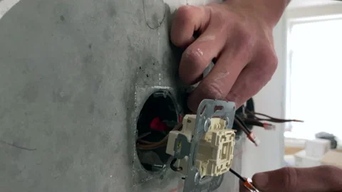 The electrician connects the socket. Stock-Footage 153803959