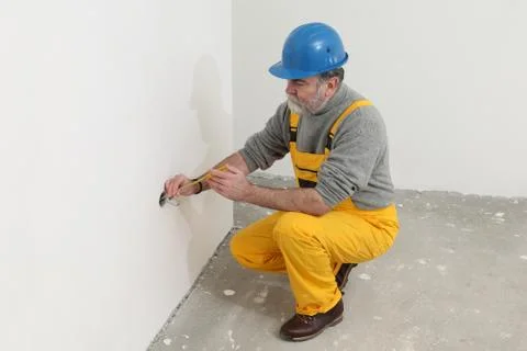 Electrician at construction site testing installation Stock-Fotos