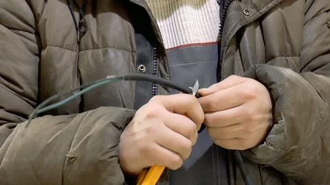 Electrician cuts wires Stock Footage 86161018