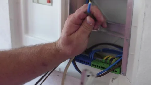 Electrician cutting electrical  cables with plier  Stock Footage 80789120